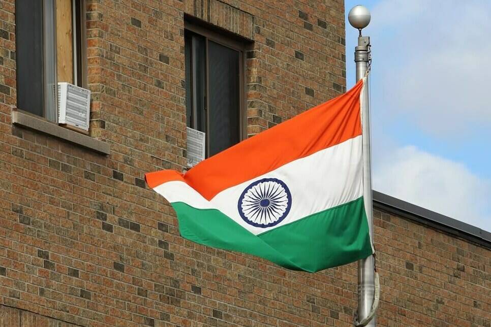 The Indian flag flies at the High Commission of India in Ottawa on Wednesday, September 20, 2023. India restored electronic visa services for Canadian nationals, an Indian foreign ministry official said Wednesday, two months after Canada alleged the South Asian nation was involved in the assassination of a Sikh separatist in Canada.THE CANADIAN PRESS/ Patrick Doyle