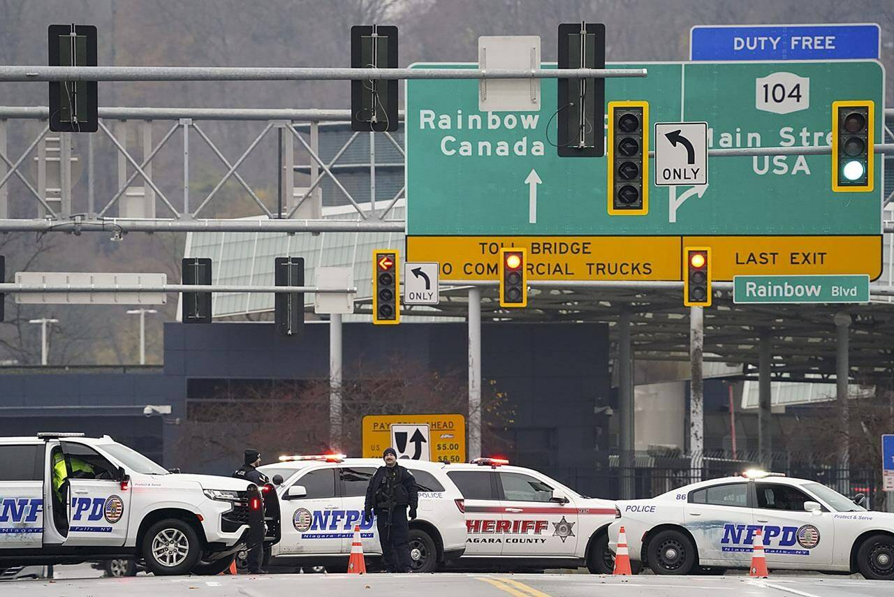 Four of the busiest border crossing points between Canada and the United States are closed after a vehicle exploded at a U.S. checkpoint in Niagara Falls. Law enforcement personnel block off the entrance to the Rainbow Bridge, in Niagara Falls, N.Y., Wednesday, Nov. 22, 2023. THE CANADIAN PRESS/AP-The Buffalo News, Derek Gee