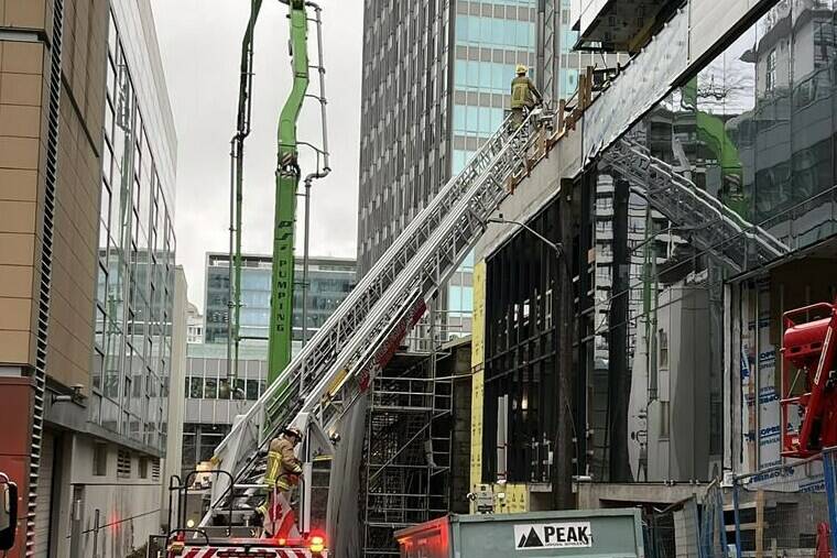 Vancouver fire says three people were hurt when a facade came off a building onto scaffolding where they were working in downtown Vancouver on Wednesday, Nov. 22, 2023. THE CANADIAN PRESS/HO-Vancouver Fire Rescue Services