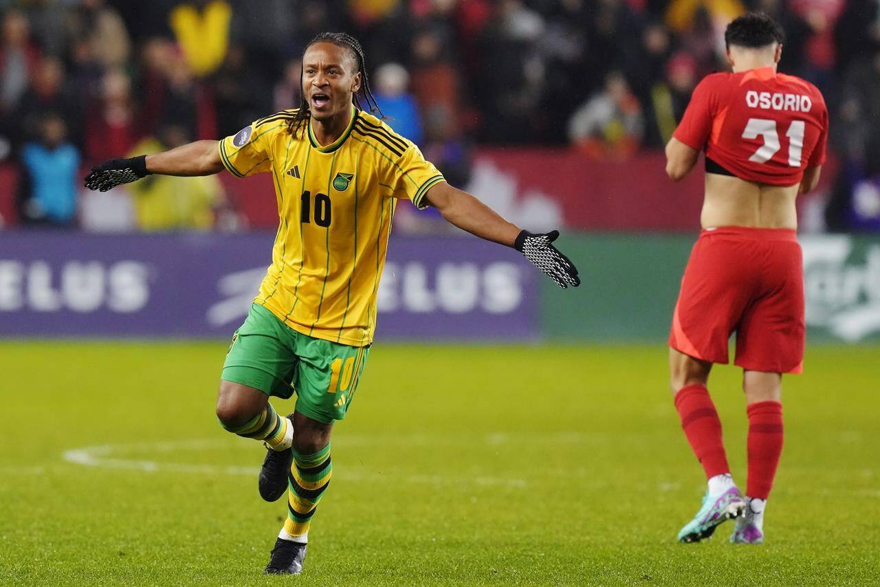 Jamaica’s Bobby Reid (10) celebrates after defeating Canada as Jonathan Osorio (21) reacts following CONCACAF Nations League quarterfinal soccer action in Toronto on Tuesday, November 21, 2023. THE CANADIAN PRESS/Chris Young