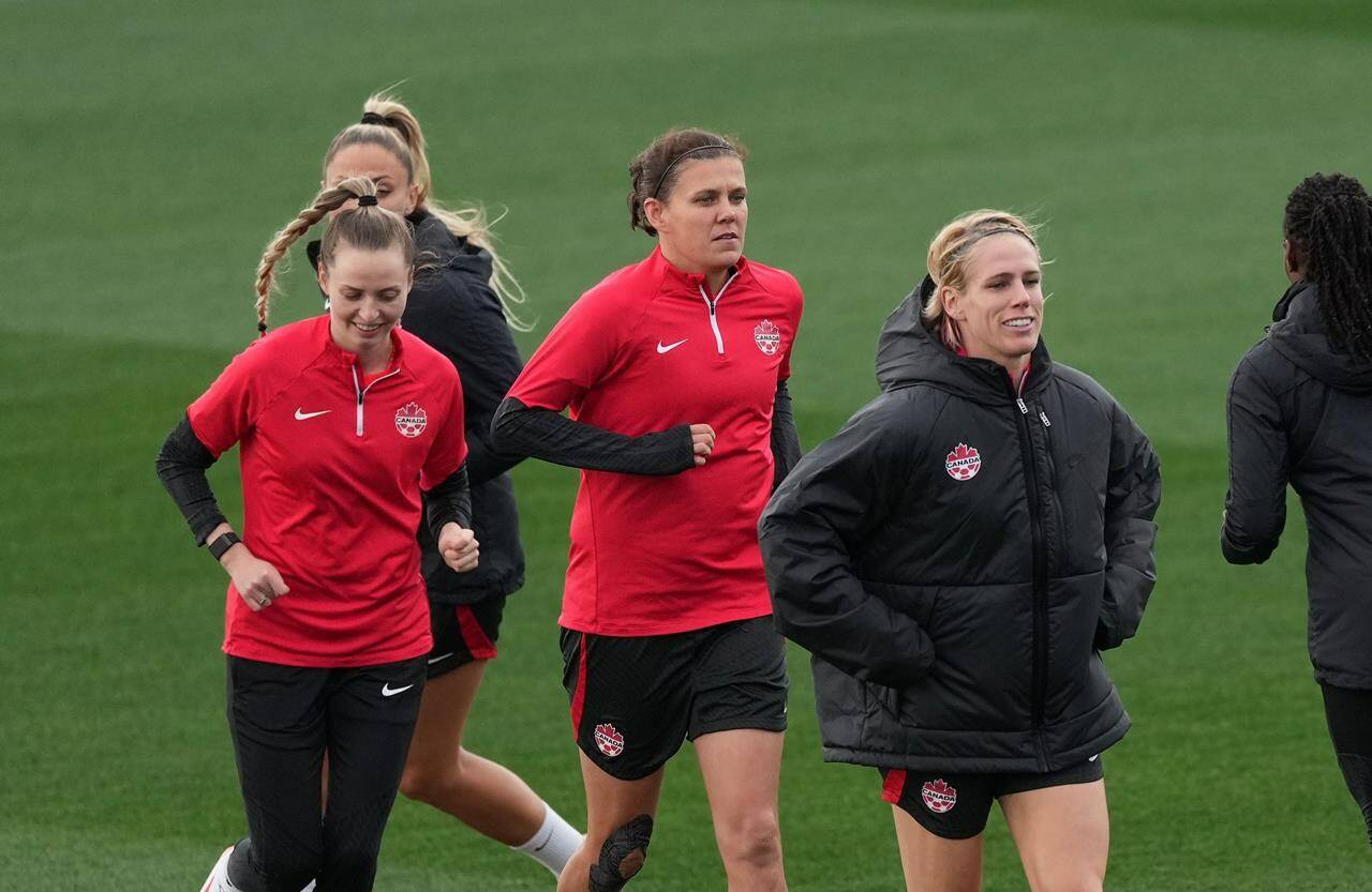 Canada’s Christine Sinclair ,centre, and Sophie Schmidt, right, run during a training session at the FIFA Women’s World Cup in Melbourne, Australia, Sunday, July 30, 2023. Captain Sinclair won’t be the only player in the spotlight when Canada hosts Australia in Victoria and Vancouver next month. Veteran goalkeeper Erin McLeod and midfielder Schmidt, who have also called time on their international career, are also being honoured at the Vancouver game. THE CANADIAN PRESS/Scott Barbour