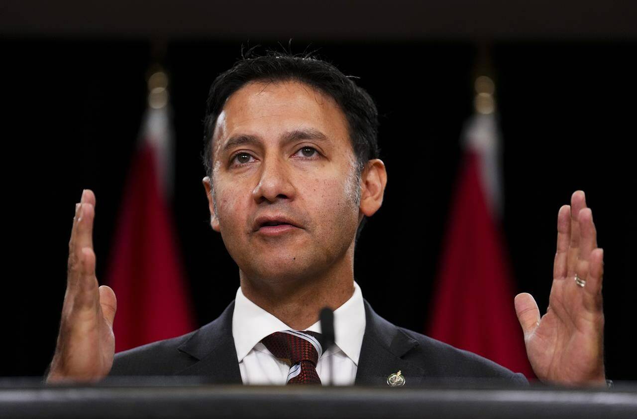Federal Justice Minister Arif Virani holds a press conference at the National Press Theatre in Ottawa on Thursday, Oct. 5, 2023. Virani is “considering the options,” raised by the independent adviser on unmarked graves, who says Indigenous leaders want Canada to move on criminalizing residential school denialism. THE CANADIAN PRESS/Sean Kilpatrick
