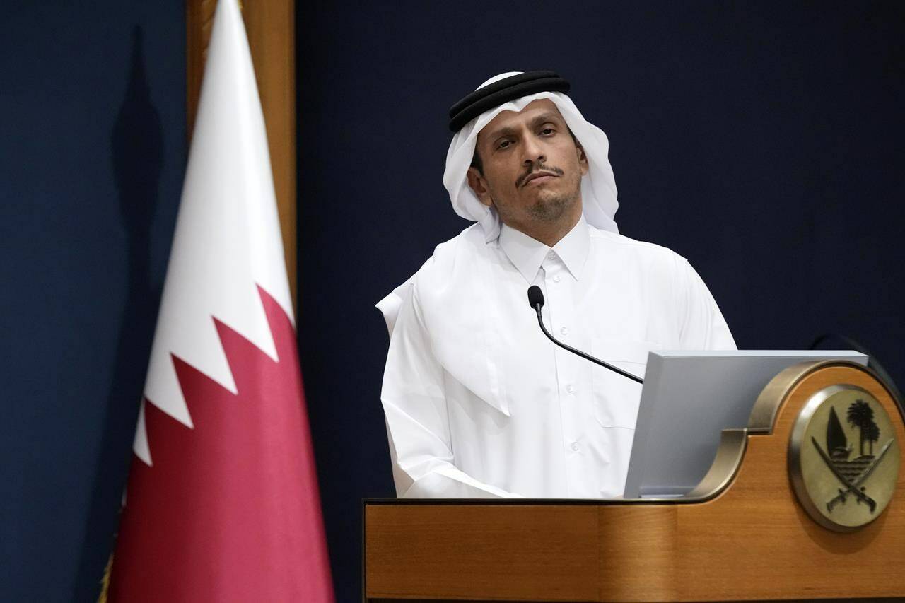 FILE - Qatar’s Prime Minister and Foreign Minister Mohammed bin Abdulrahman Al Thani listens a question with U.S. Secretary of State Antony Blinken in Doha, Qatar, Friday Oct. 13, 2023. Qatar is the go-to mediator in the Israel-Hamas war. On Saturday, Nov. 25, 2023, a Qatari jet landed in Israel’s Ben-Gurion International Airport with an urgent task: save the cease-fire deal between Israel and Gaza’s Hamas rulers. (AP Photo/Jacquelyn Martin, Pool, File)