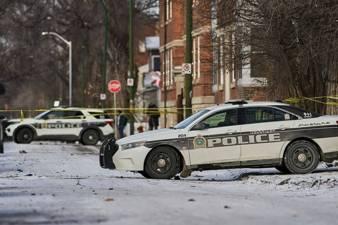 Police secure a crime scene where multiple people were killed in the 100 block of Langside Street in Winnipeg on Sunday, Nov. 26, 2023. THE CANADIAN PRESS/David Lipnowski