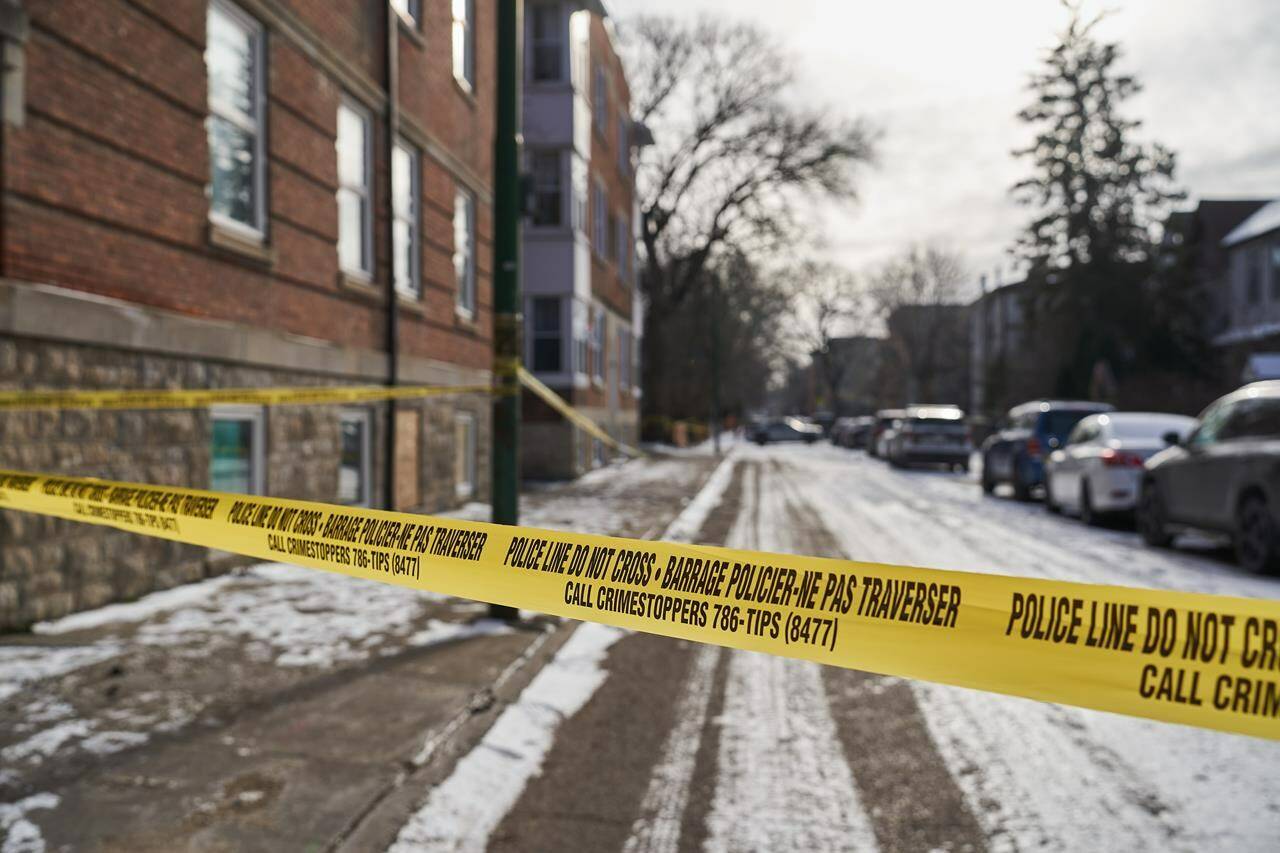 Police secure a crime scene where multiple people were killed in the 100 block of Langside Street in Winnipeg on Sunday, Nov. 26, 2023. A Metro Vancouver MP says he stands by his social media post that questioned if there was a connection between Conservative Leader Pierre Poilievre and a weekend shooting in Manitoba that killed four people.THE CANADIAN PRESS/David Lipnowski