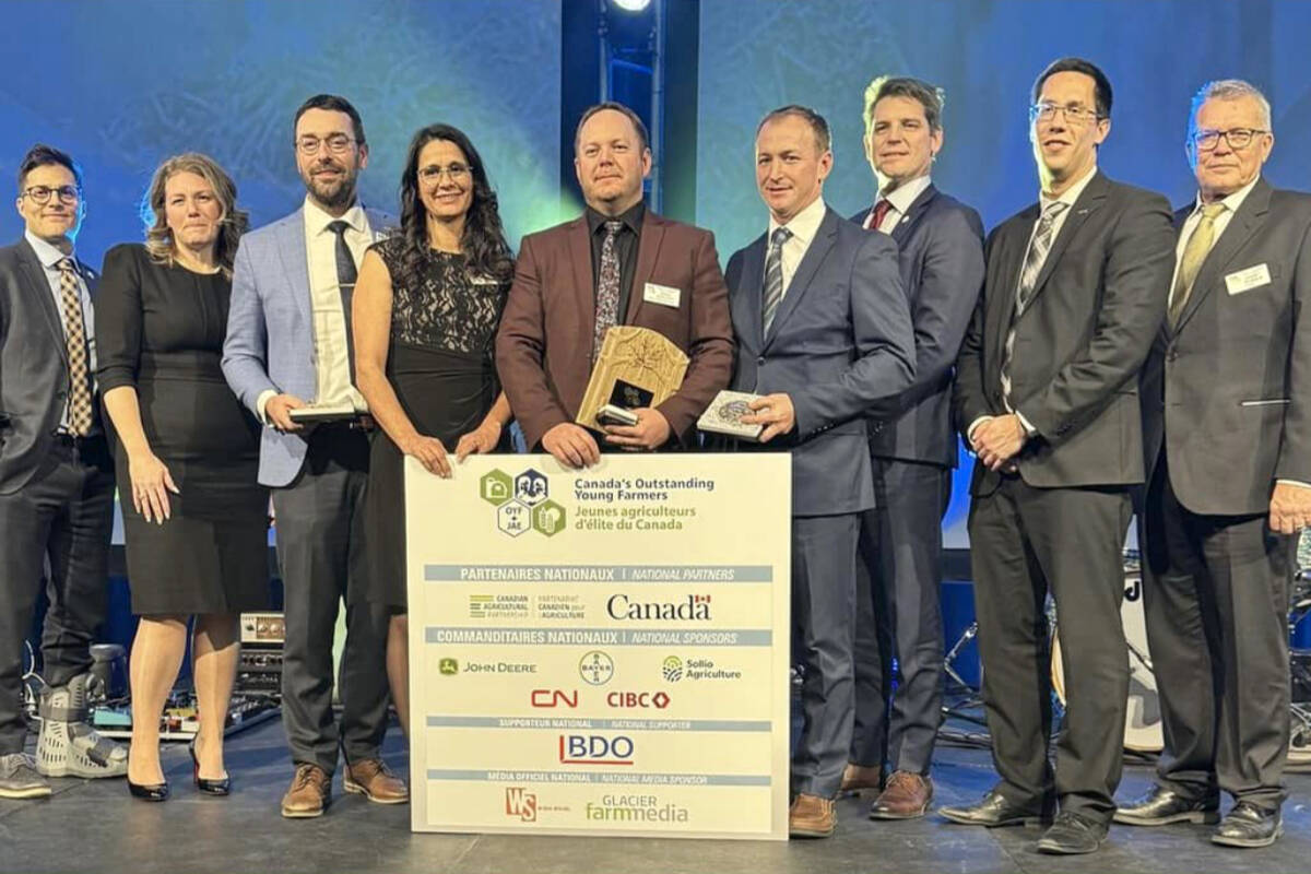 Brad Hopcott (centre) and Travis Hopcott (centre-right) were one of the winners of the 2023 Canada’s Outstanding Young Farmers award. (Canada’s Outstanding Young Farmers/Special to The News)