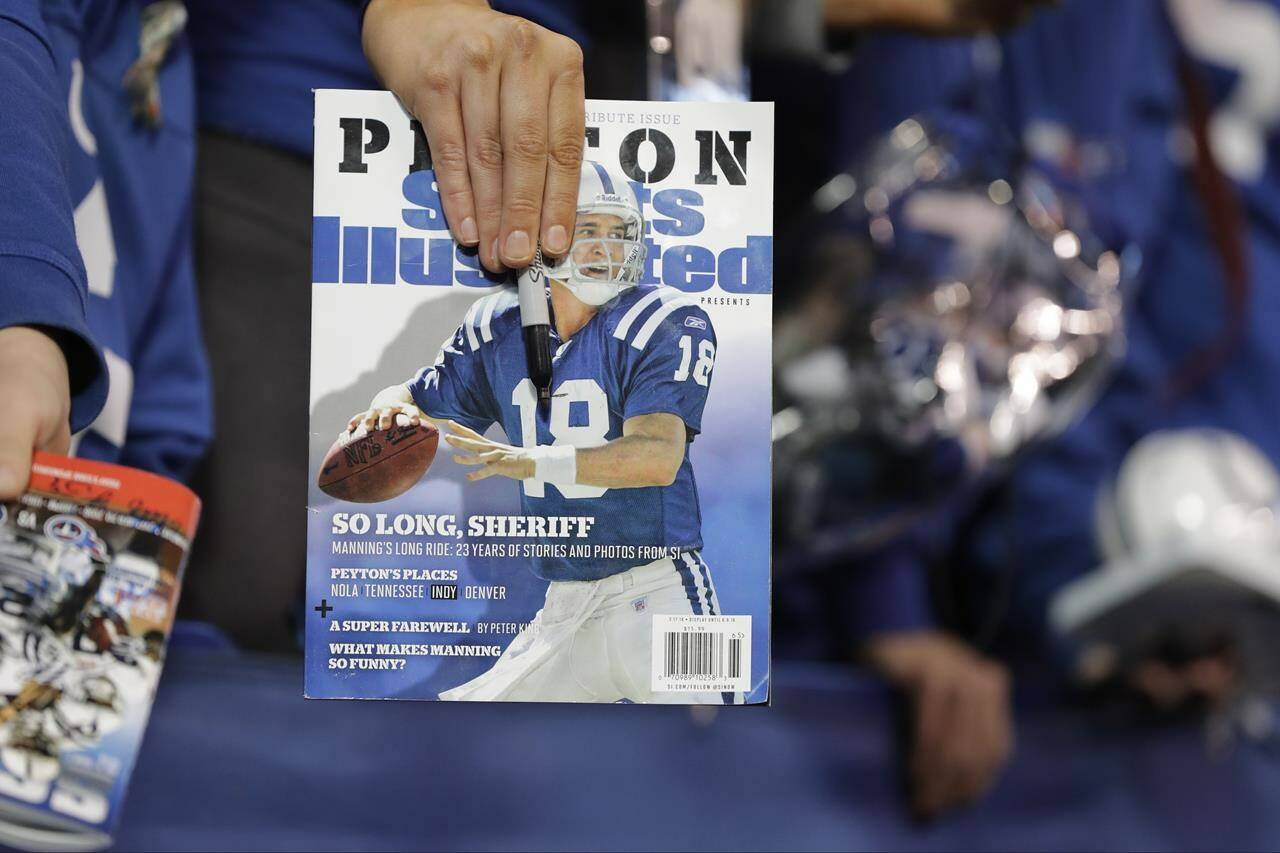 FILE - A fan waits for former Indianapolis Colts quarterback Peyton Manning to sign autographs before an NFL football game between the Tennessee Titans and the Indianapolis Colts, Nov. 20, 2016, in Indianapolis. Sports Illustrated is the latest media company damaged by being less than forthcoming about who or what is writing its stories. The website Futurism reported that the once-grand magazine used articles with “authors” who apparently don’t exist, with photos generated by AI. The magazine denied claims that some articles themselves were AI-assisted, but has cut ties with a vendor it hired to produce the articles. (AP Photo/Darron Cummings, File)