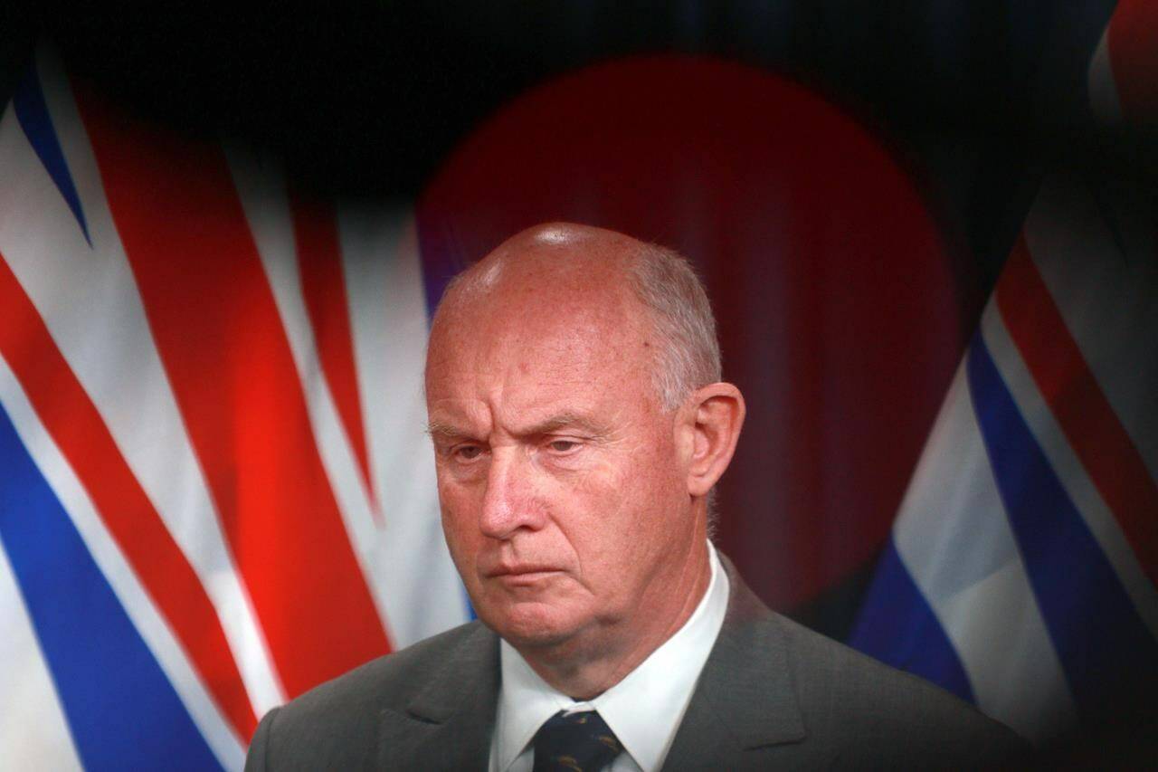 Minister of Public Safety and Solicitor General Mike Farnworth looks on after an announcement at the legislature in Victoria, B.C., on Thursday, Oct. 5, 2023. Farnworth says the government has filed the first-ever application to secure an unexplained wealth order in Canada. THE CANADIAN PRESS/Chad Hipolito