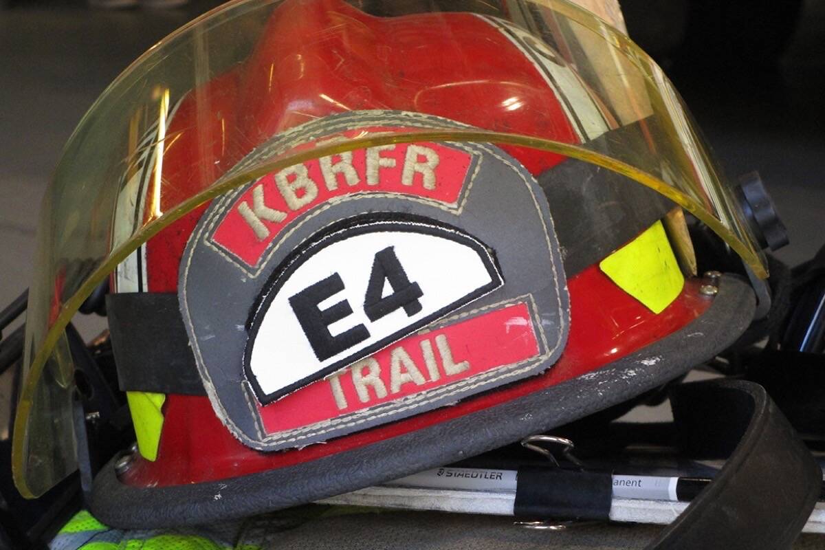 Three Trail firefighters have been charged after an alleged assault on a man back in April 2023. Pictured, a Kootenay Boundary Fire and Rescue helmet. (File photo)