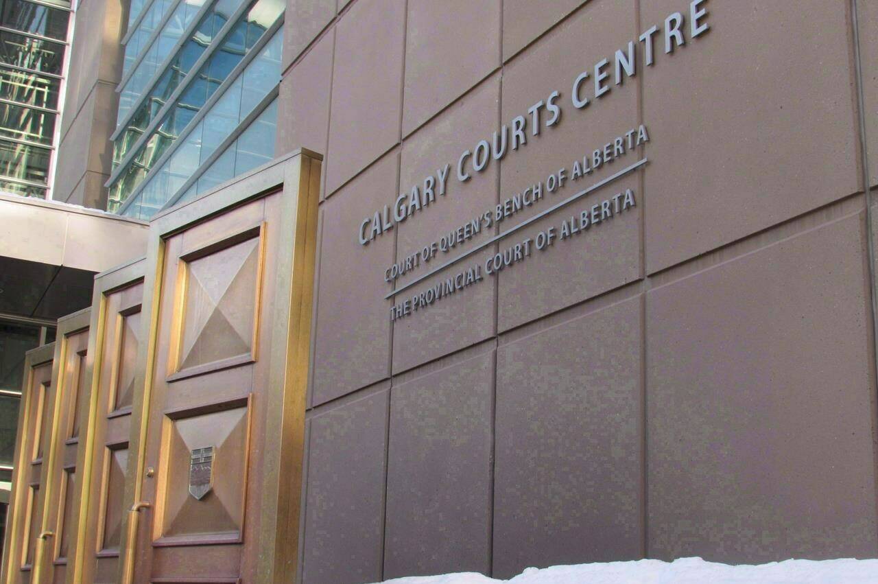 A 20-year old Calgary man has pleaded guilty to one count of facilitating terrorist activity. The sign at the Calgary Courts Centre in Calgary is shown on Friday, Jan. 5, 2018. THE CANADIAN PRESS/Bill Graveland