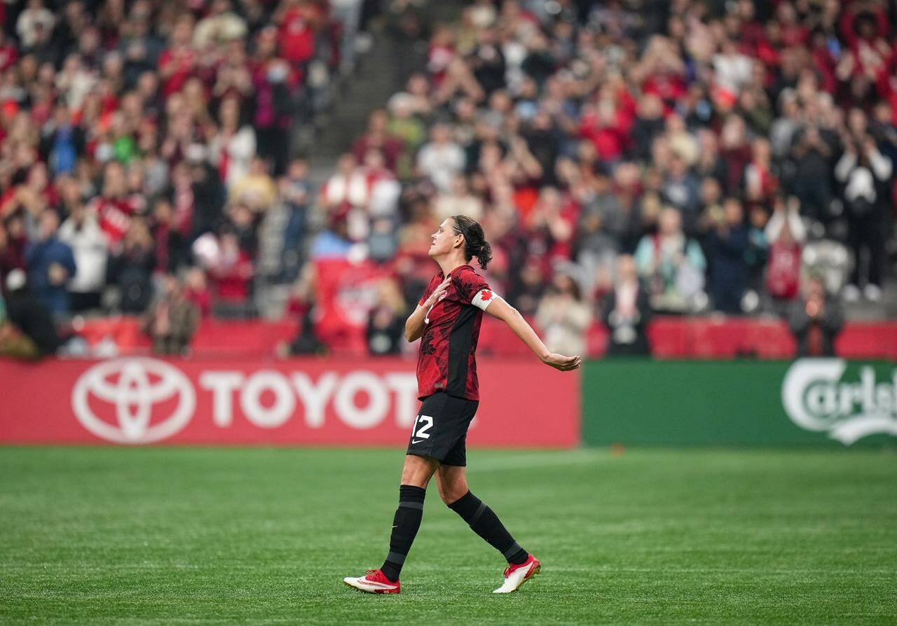 Canada’s Christine Sinclair gestures to the crowd as she leaves the game in place of substitute Sophie Schmidt, not seen, during the second half of an international friendly soccer match, in Vancouver, on Tuesday, Dec. 5, 2023. THE CANADIAN PRESS/Darryl Dyck