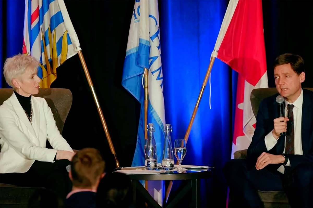 Fiona Famulak, president of the BC Chamber of Commerce, and Premier David Eby speak during the BC Chamber of Commerce’s Premier and Cabinet Luncheon in Vancouver Thursday. (Screencap)