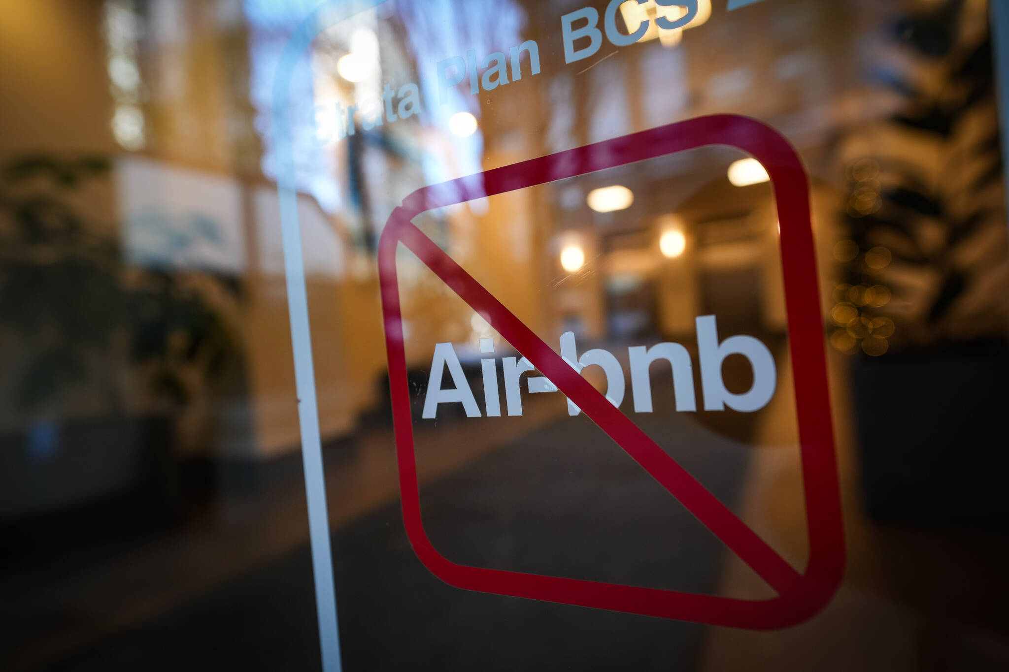 A sign indicating Airbnb rentals are not permitted is seen at the entrance to a condo tower, in Vancouver, on Thursday, November 23, 2023. The provincial government last month introduced legislation to limit short-term rentals in many cities in British Columbia in an effort to put thousands of units back into the long-term rental pool, with the changes coming into effect in May. THE CANADIAN PRESS/Darryl Dyck