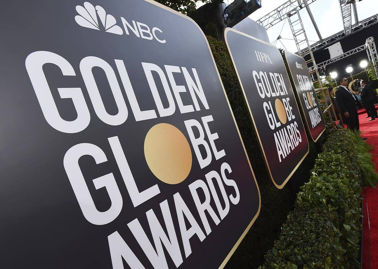 Event signage appears above the red carpet at the annual Golden Globe Awards, Sunday, Jan. 5, 2020, in Beverly Hills, Calif. (Photo by Jordan Strauss/Invision/AP, File)