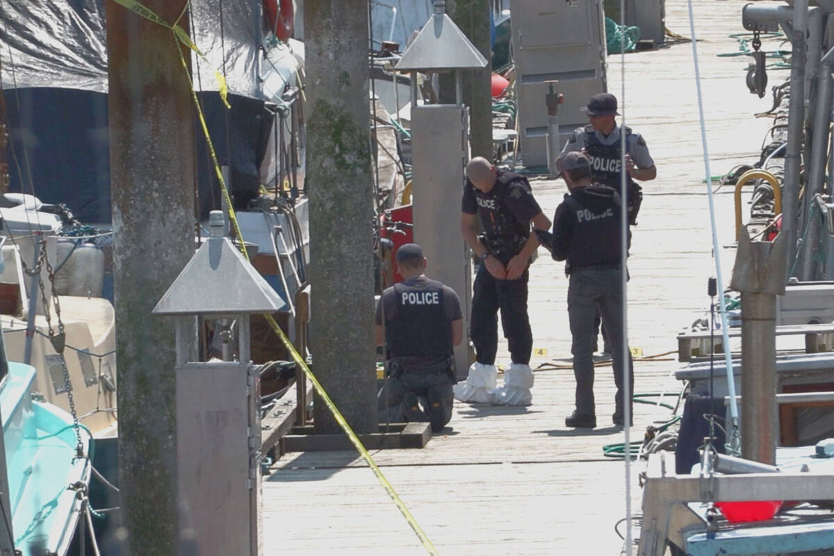 Investigators process the scene of a police-involved fatal shooting and what police said is a reported homicide of a second person on Monday, June 13, 2022 at the government wharf in Discovery Harbour. Photo contributed