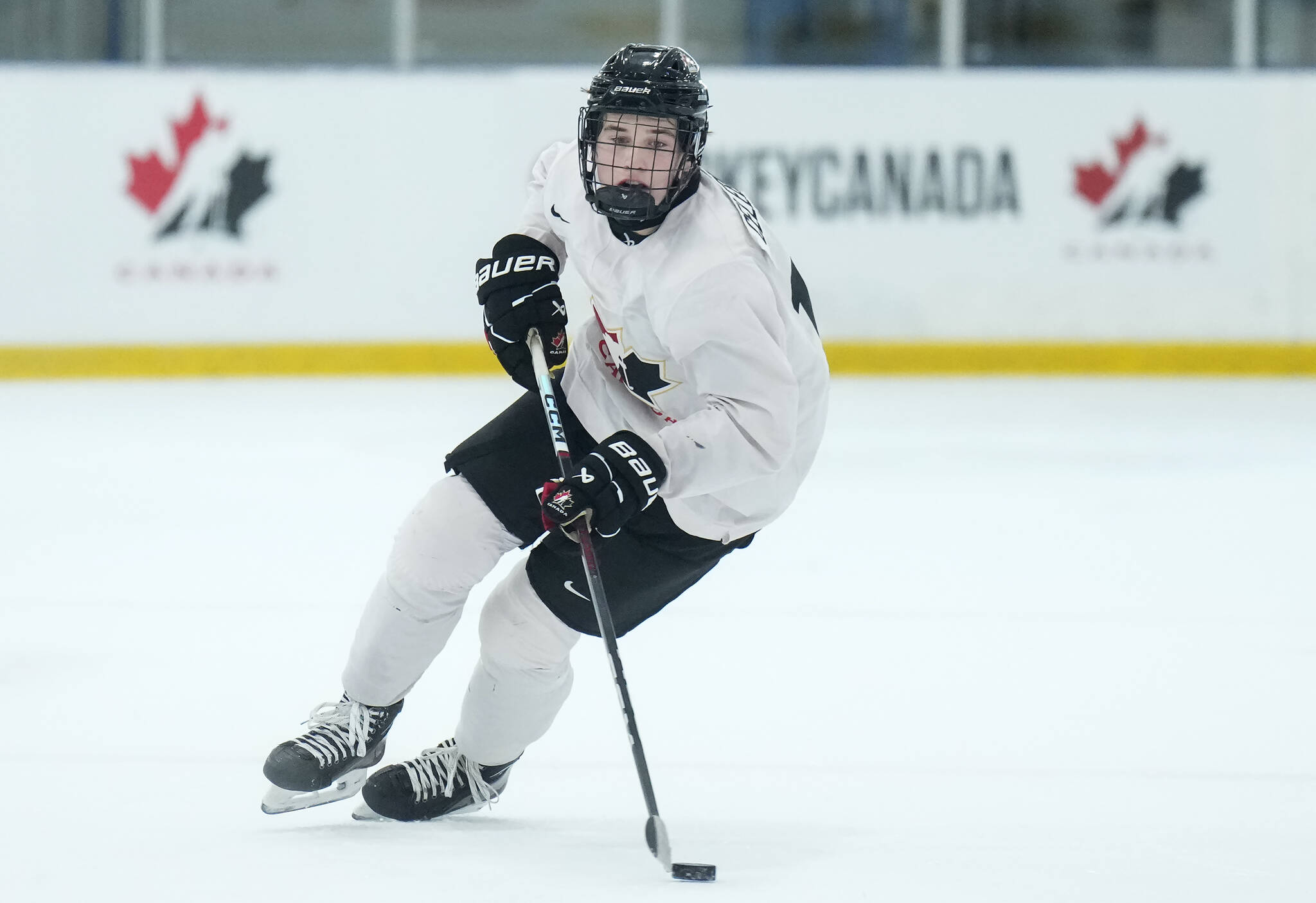 Canada forward Macklin Celebrini breaks up ice in practice during Canadian World Juniors selection camp in Oakville, Ont., on Monday, December 11, 2023. THE CANADIAN PRESS/Nathan Denette