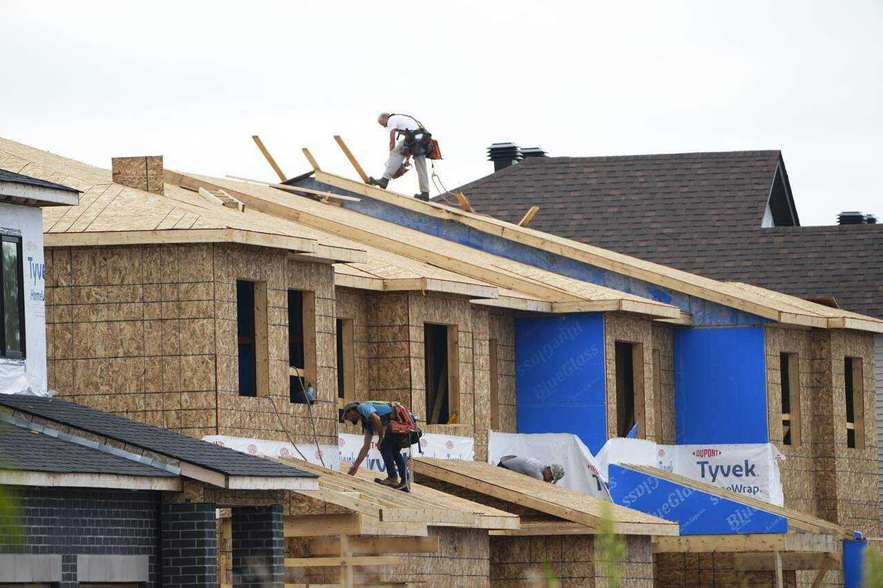 New homes are constructed in Ottawa on Monday, Aug. 14, 2023. The federal government is planning to launch a catalogue of pre-approved home designs to speed up the homebuilding process for developers. THE CANADIAN PRESS/Sean Kilpatrick