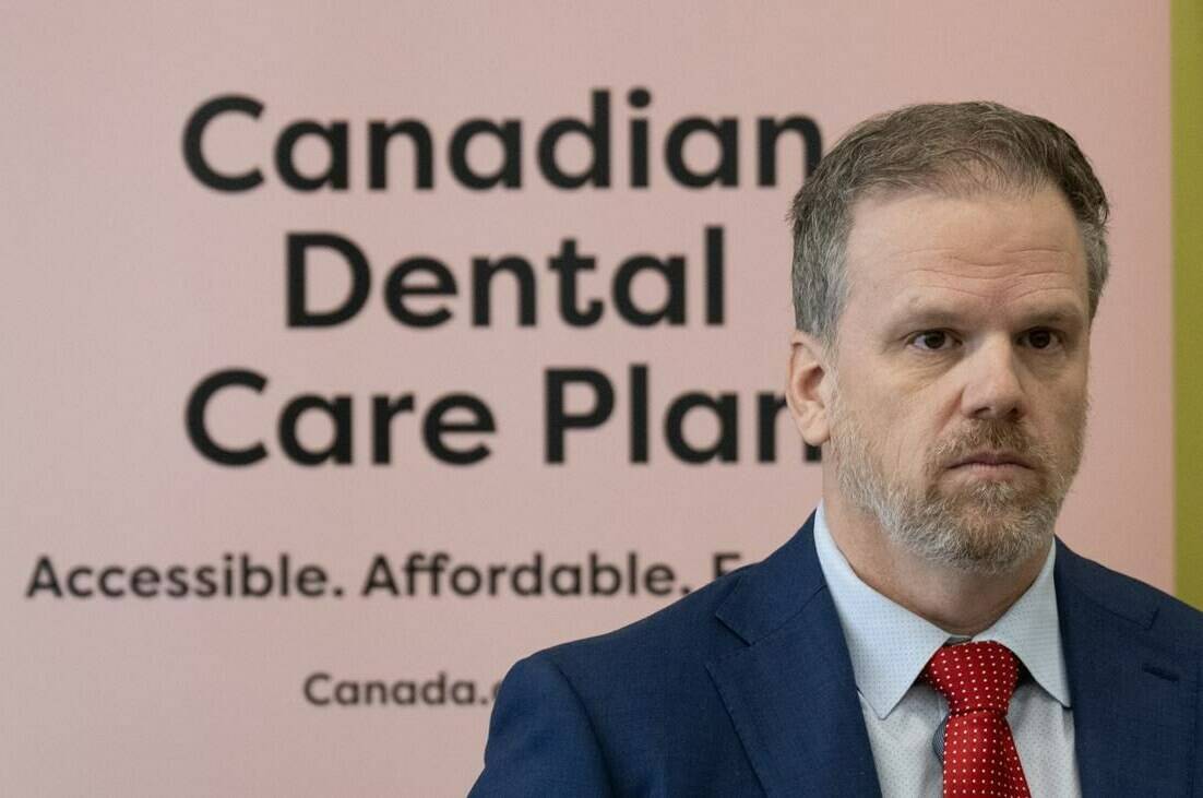 Minister of Health Mark Holland listens to a question following an announcement on dental care, Monday, December 11, 2023 in Ottawa. The federal government has announced enrolment details for a new federal dental plan that resembles typical insurance coverage, down to the benefits card patients show at the dentists’ office. THE CANADIAN PRESS/Adrian Wyld