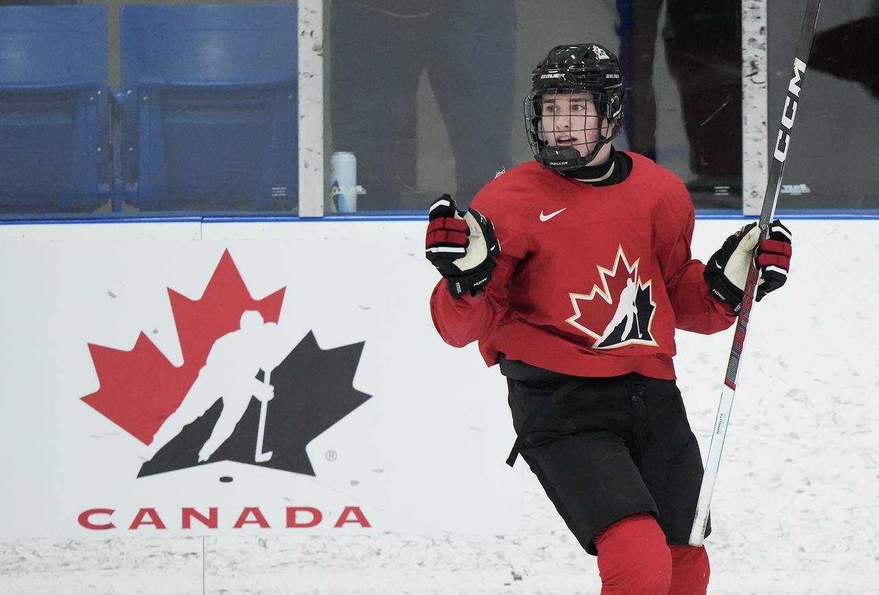 Canada forward Macklin Celebrini celebrate his goal against U Sports during first period Canadian World Juniors selection camp hockey action in Oakville, Ont., on Wednesday, December 13, 2023. THE CANADIAN PRESS/Nathan Denette