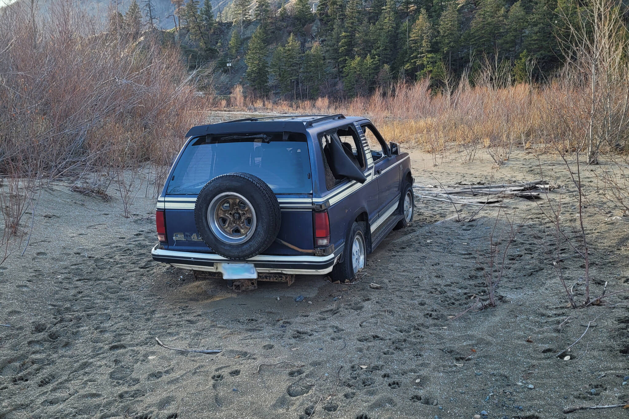 The pictured vehicle has been sitting near abandoned near the Similkameen River for months, frustrating residents nearby. (Bob McAtamney - Contributed)