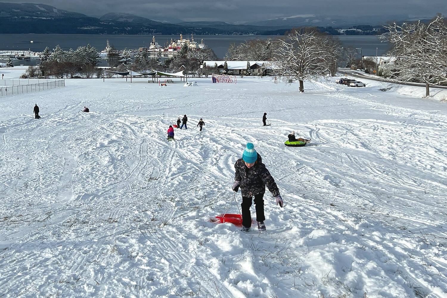 Children hit the sledding hill off Mills Road in North Saanich near Victoria International Airport after a late-December snowfall in 2021. (Black Press Media file photo)