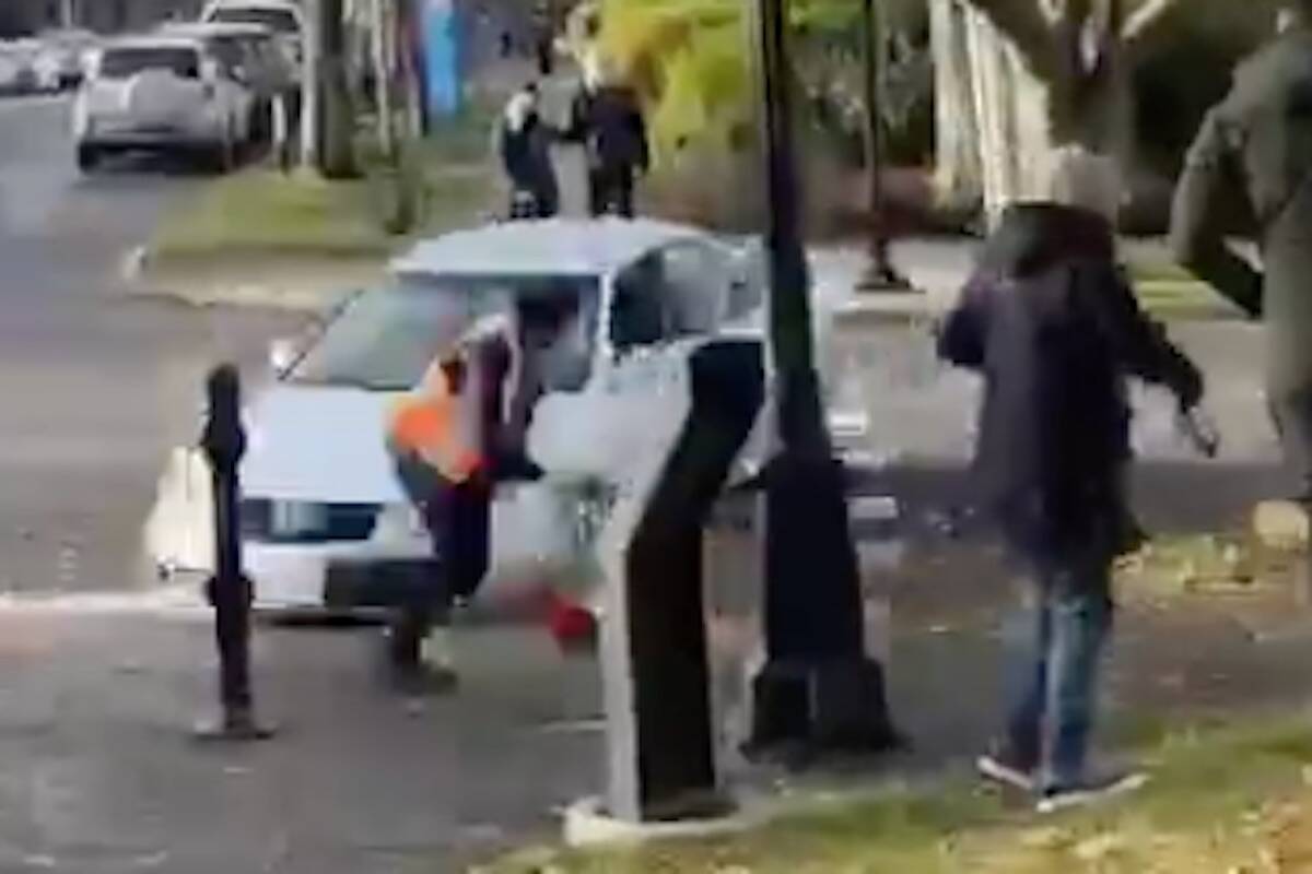 The driver of this car was arrested and has been charged after he tried to accelerate into a demonstrator of a Palestine peach march in Victoria on Dec. 3. (Screenshot courtesy of the National Council of Canadian Muslims/X)