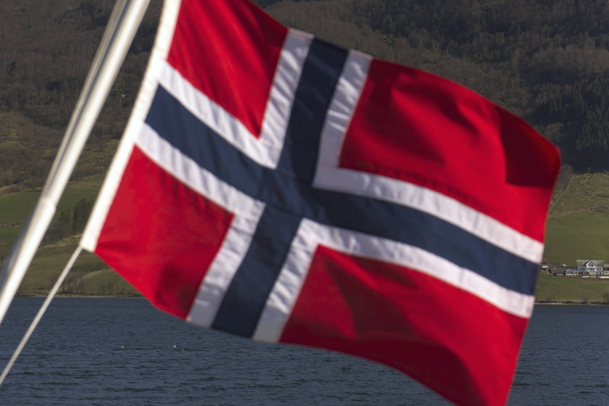 The Norwegian national flag in Olensvag, Norway, on April 3, 2012. MUST CREDIT: Bloomberg photo by Kristian Helgesen.