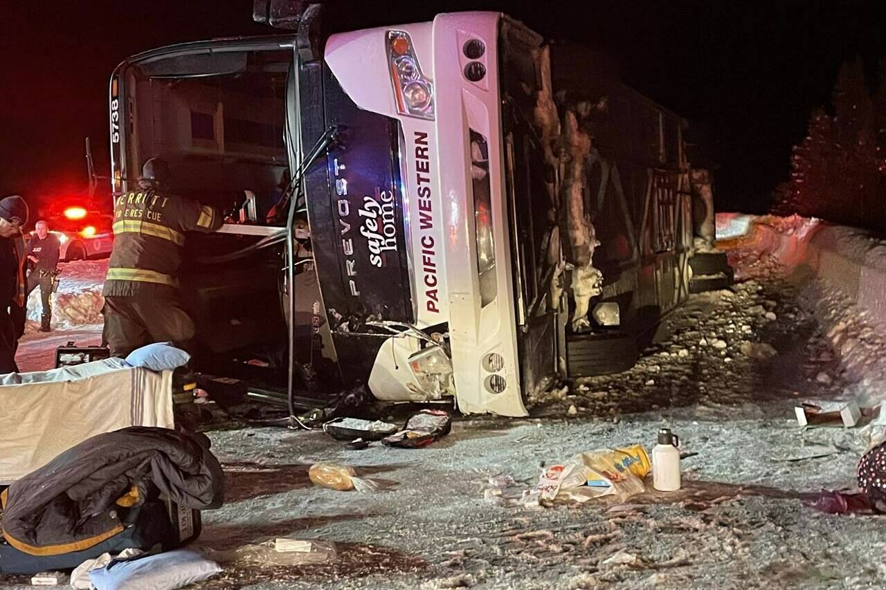 First responders look over the scene of a bus crash on Highway 97C Okanagan Connector between Merritt and Kelowna in this Saturday, Dec. 24, 2022 handout photo. The BC Prosecution Service says there will be no charges stemming from the Christmas Eve 2022 bus crash that claimed four lives. THE CANADIAN PRESS/HO, Bill Gerber