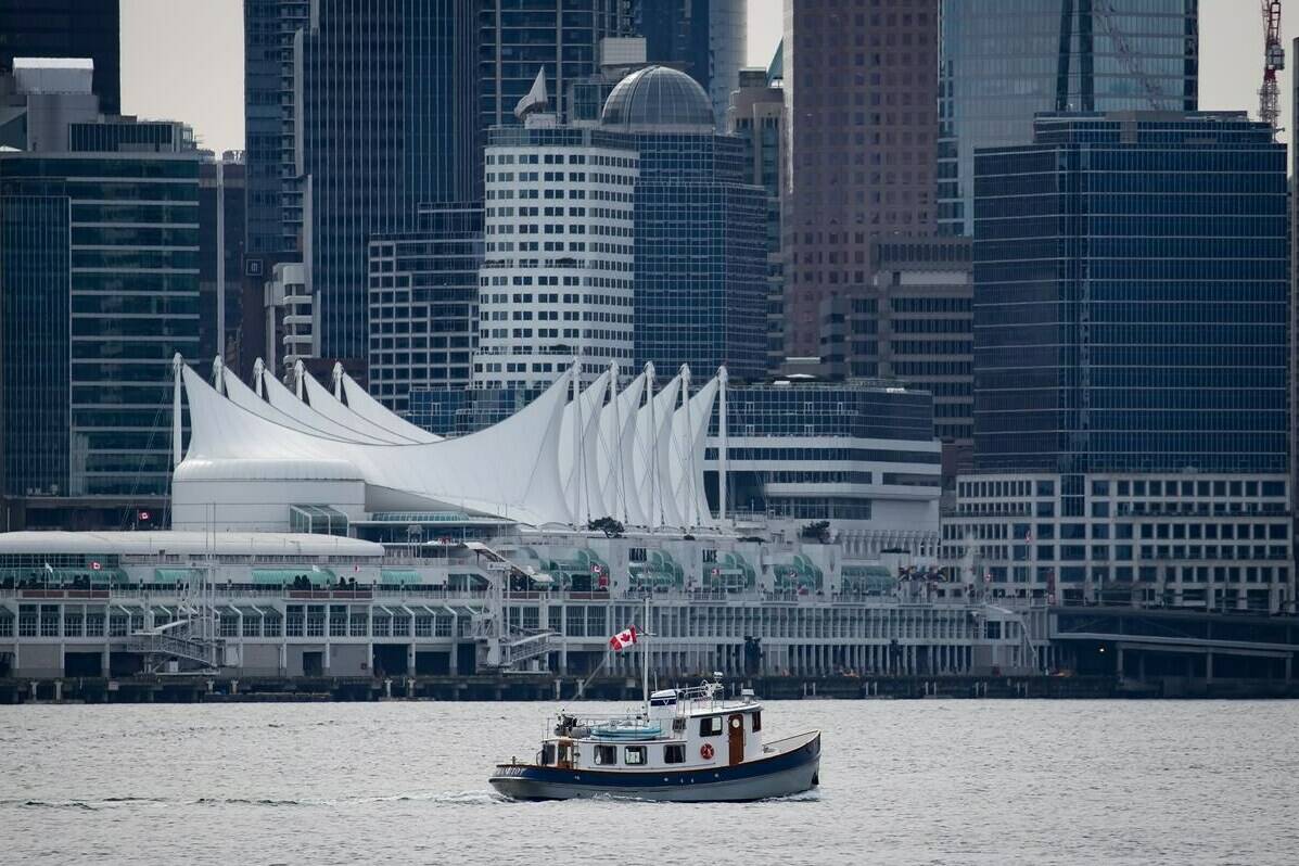 A recreational boat travels on the harbour as Canada Place and the downtown Vancouver skyline are seen from North Vancouver, B.C., Saturday, March 12, 2022. Statistics Canada released its latest data Dec. 19, 2023 on Canada’s population estimates for the third quarter of 2023, and B.C. is continuing to lose more residents to interprovincial migration than it’s gaining. THE CANADIAN PRESS/Darryl Dyck