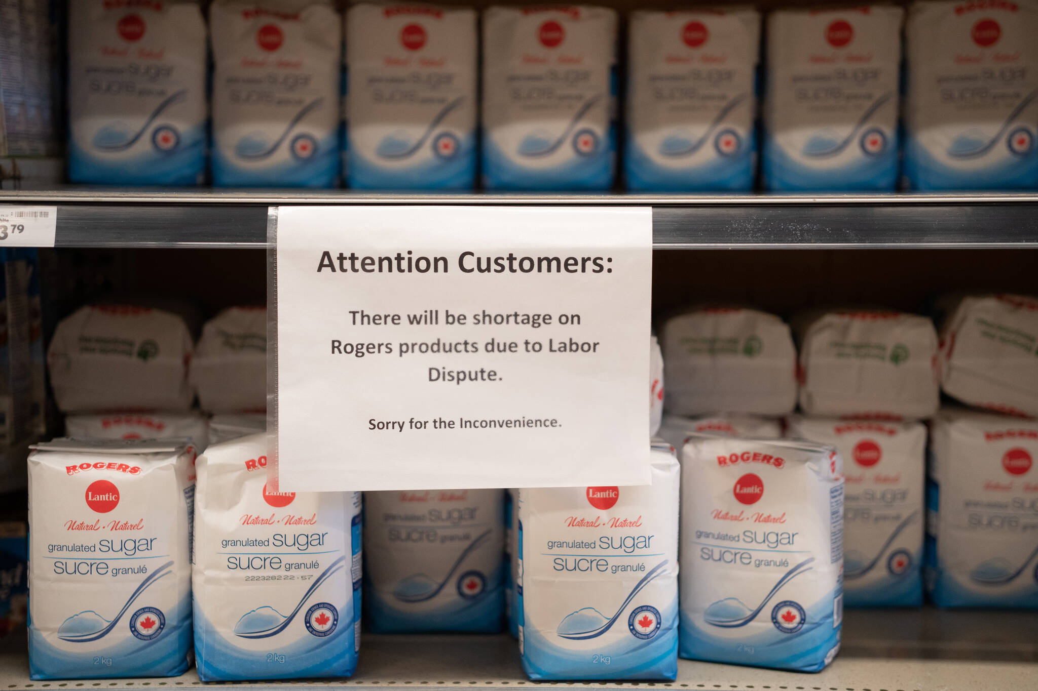 A sign is put up on Rogers Sugar shelves at a grocery store in Vancouver, on Thursday, Nov. 16, 2023. THE CANADIAN PRESS/Ethan Cairns