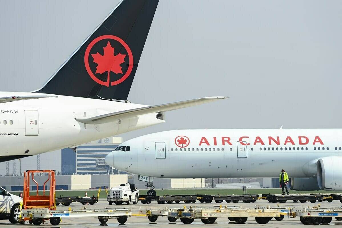 Air Canada planes sit on the tarmac at Pearson International Airport in Toronto on Wednesday, April 28, 2021. The Canadian Transportation Agency says it’s issued a penalty to Air Canada for violating the Accessible Transportation for Persons with Disabilities Regulations.THE CANADIAN PRESS/Nathan Denette