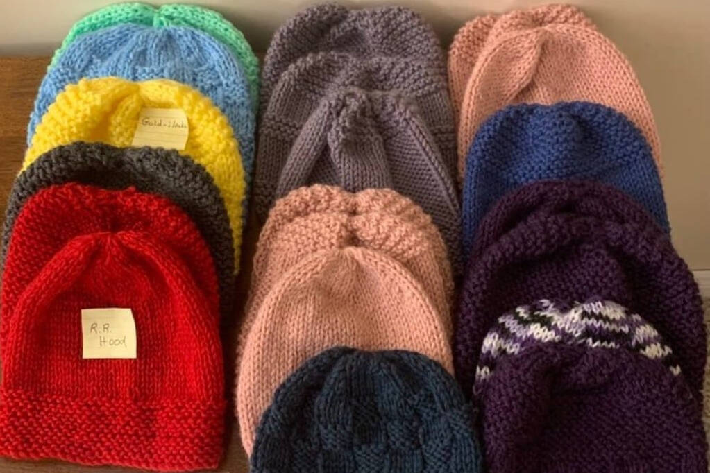 Diane Buchanan Holland collects new and often handmade toques to hand out to those facing housing or other challenges in winter. (Diane Buchanan Holland/Facebook)