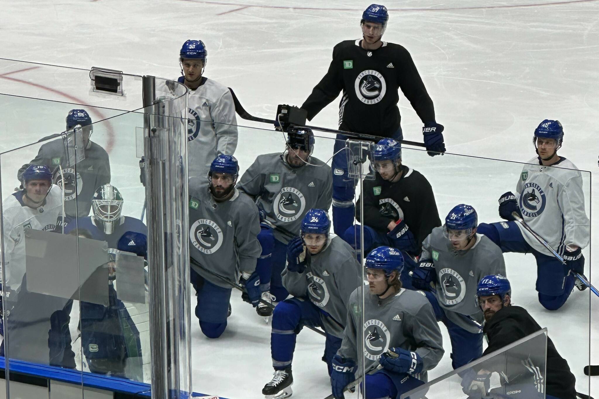 A rare sight - Canucks coaches using the dry board to explain a drill during practice. Black Press Media photo