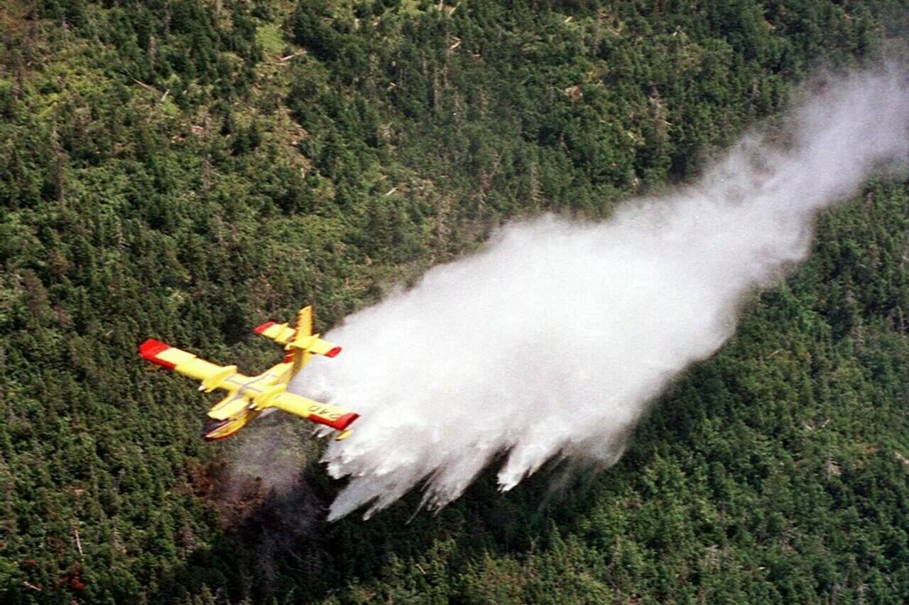 As the smoke lifts on the worst wildfire season ever recorded in Canada, some question whether the country has the fleet of aerial water bombers it needs keep up with longer, more intense seasons fuelled by climate change. A Canadair waterbomber drops a load of water over the Cape Breton Highlands in Nova Scotia on Friday Aug. 10, 2001. THE CANADIAN PRESS