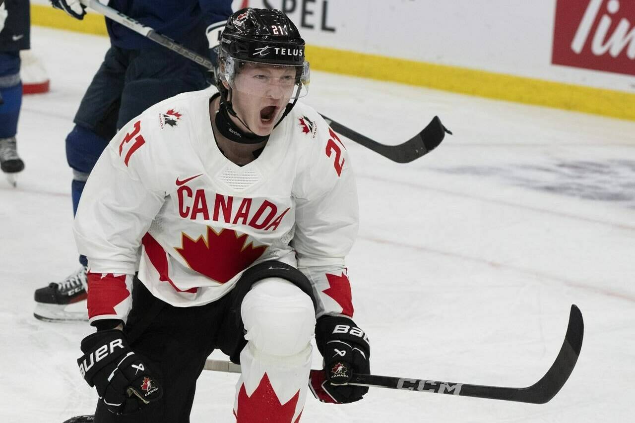 For the second year in a row, Team Canada is celebrating its goals at the world junior ice hockey championship with a song from Newfoundland. Canada’s Owen Allard (21) celebrates his goal against Finland during second period hockey action at the IIHF World Junior Hockey Championship in Gothenburg, Sweden on Tuesday, Dec. 26, 2023. THE CANADIAN PRESS/Christinne Muschi