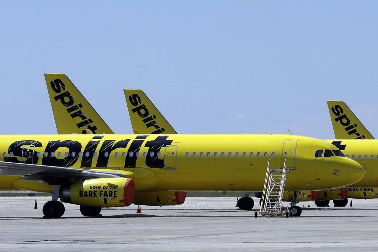 A line of Spirit Airlines jets sit on the tarmac at Orlando International Airport on May 20, 2020, in Orlando, Fla. A 6-year-old boy who left on a flight for the Christmas holiday to visit his grandmother was put on the wrong plane. When the grandmother, up on Thursday, Dec. 21, 2023 at the airport in Fort Myers to greet her grandson who was flying for the first time from Philadelphia, she was told he wasn’t on the Spirit Airlines flight. (AP Photo/Chris O’Meara, File)