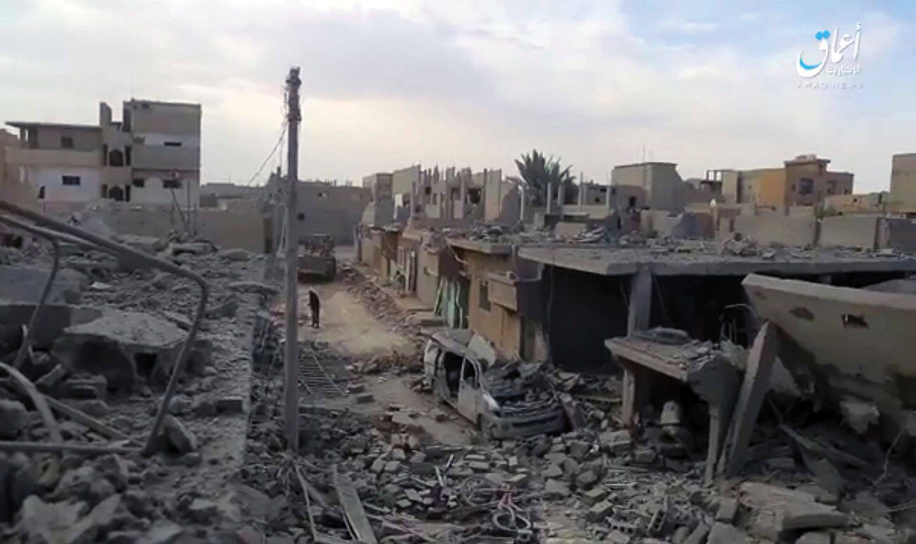 This image made from militant video posted online on Tuesday, April. 18, 2017 by the Aamaq News Agency, a media arm of the Islamic State group, purports to shows destroyed houses following a U.S.-led coalition strike in the eastern Syrian town of Boukamal, on the Iraqi border. Boukamal was the site of another attack Dec. 30, 2023.	(Aamaq News Agency via AP)