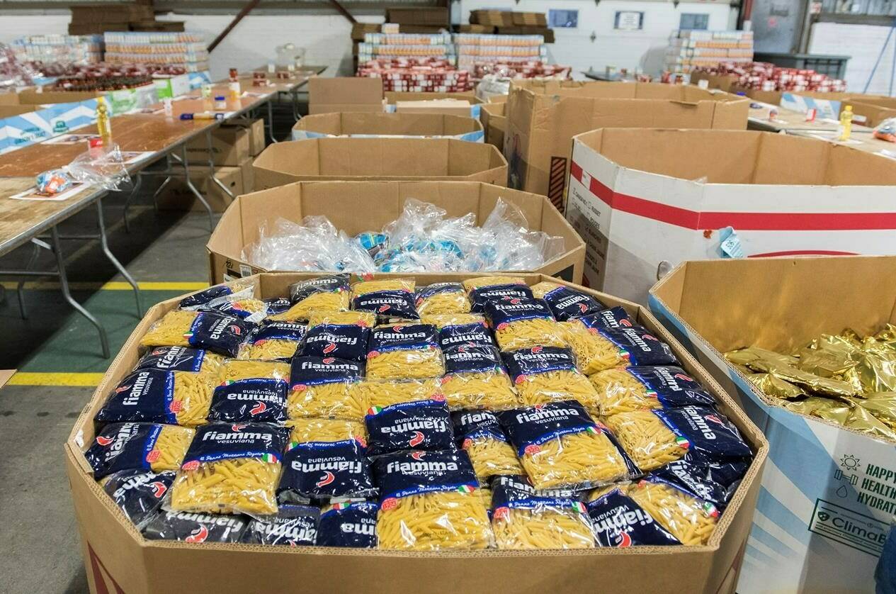 Boxes of donated food items are shown at the Moisson Montreal food bank in Montreal, Saturday, December 7, 2019. THE CANADIAN PRESS/Graham Hughes