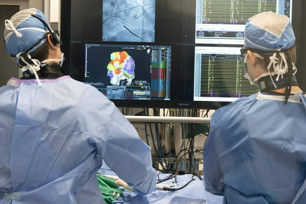 The rise of new technologies has thrust artificial intelligence into the spotlight throughout 2023 — and health care is no exception. An electrophysiologist performs a ventricular tachycardia ablation at Sacre-Coeur Hospital, Wednesday, July 26, 2023 in Montreal.THE CANADIAN PRESS/Ryan Remiorz