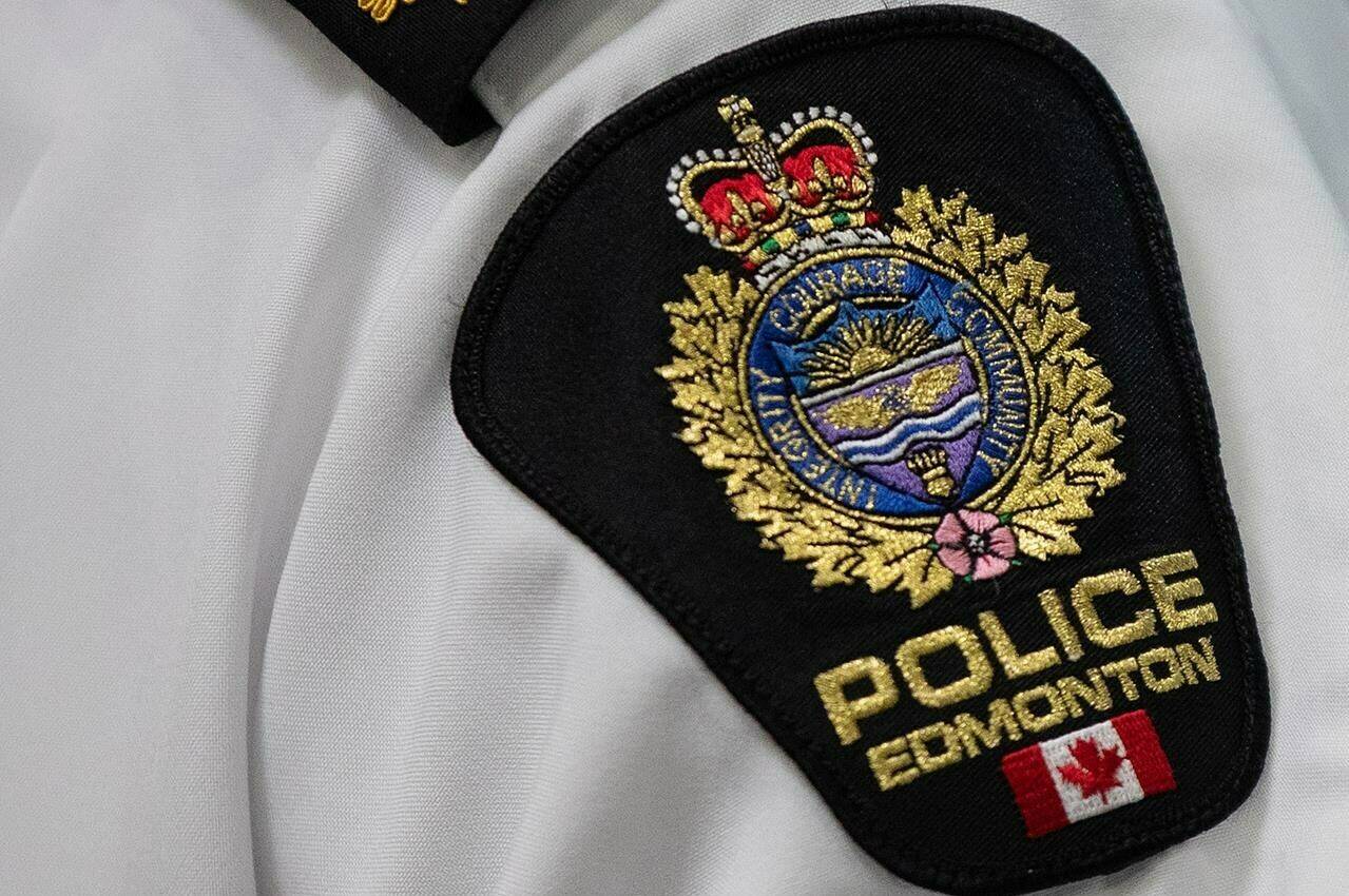 A passenger on a transit bus in Edmonton is in critical condition after police say she fell out the vehicle’s back door. An Edmonton Police Service shoulder badge is shown in Edmonton on Tuesday Aug 1, 2023. THE CANADIAN PRESS/Jason Franson.