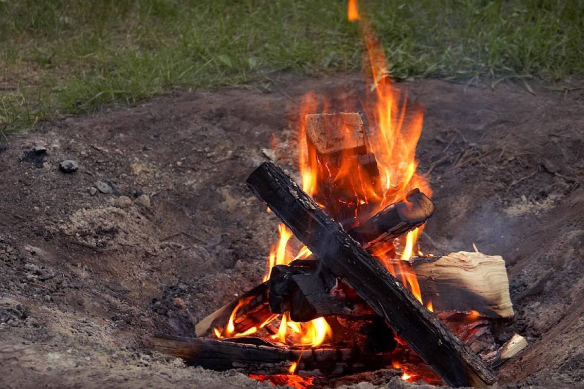 The crackle of a campfire is a familiar, pleasing sound. (File photo)