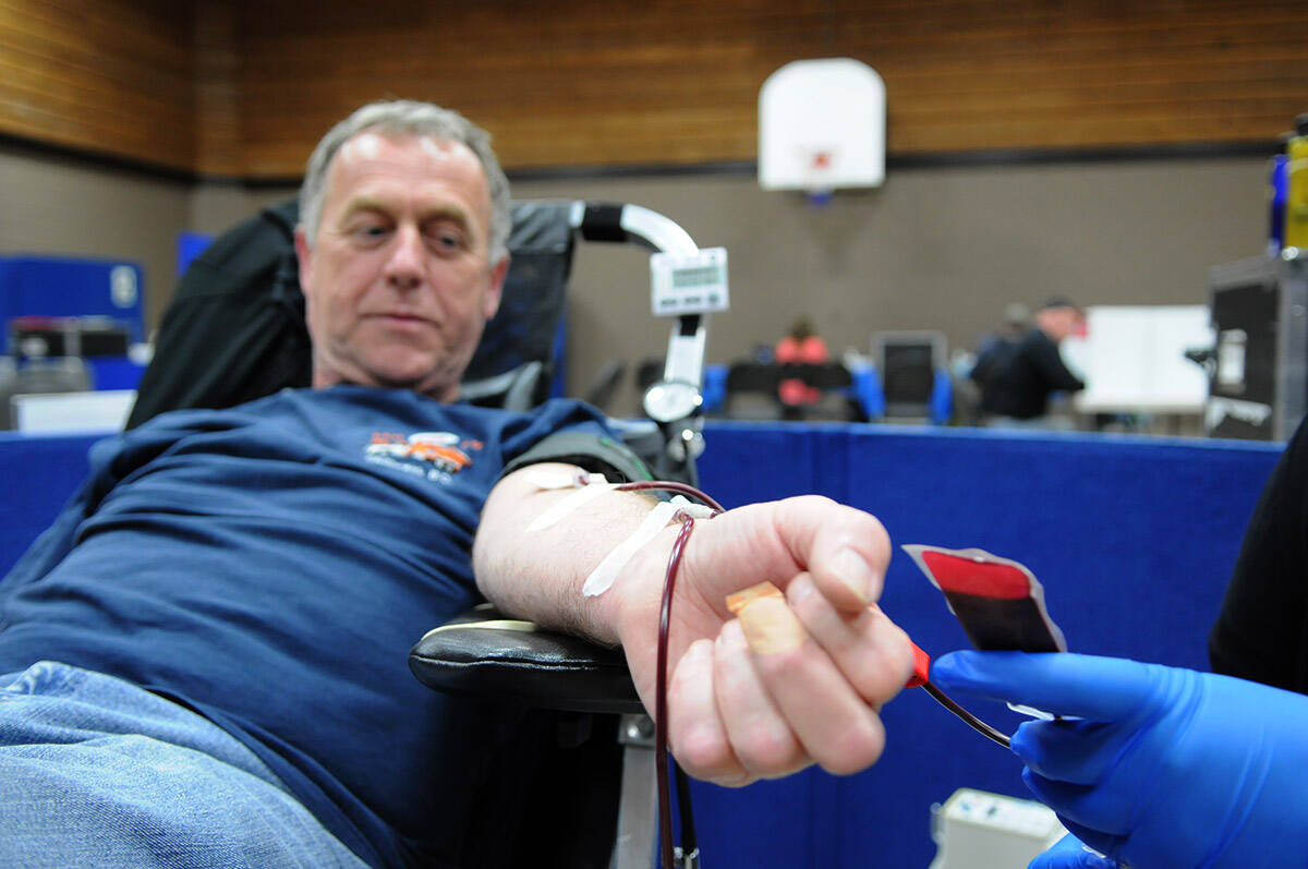 In this May 27, 2013 file photo, Ross Yaxley of Chilliwack makes his 100th blood donation. (Jenna Hauck/Black Press Media file photo)