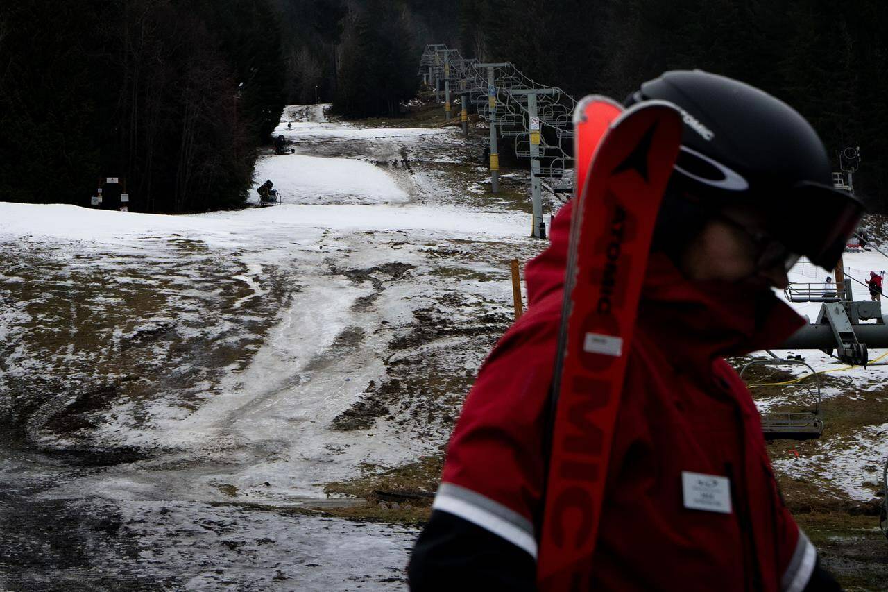 The slopes are bare near the base of Blackcomb Mountain in Whistler, B.C., on Friday, Dec. 29, 2023. British Columbians basked in a balmy December to wrap up 2023, but it wasn’t quite warm enough to break temperature records. THE CANADIAN PRESS/Ethan Cairns