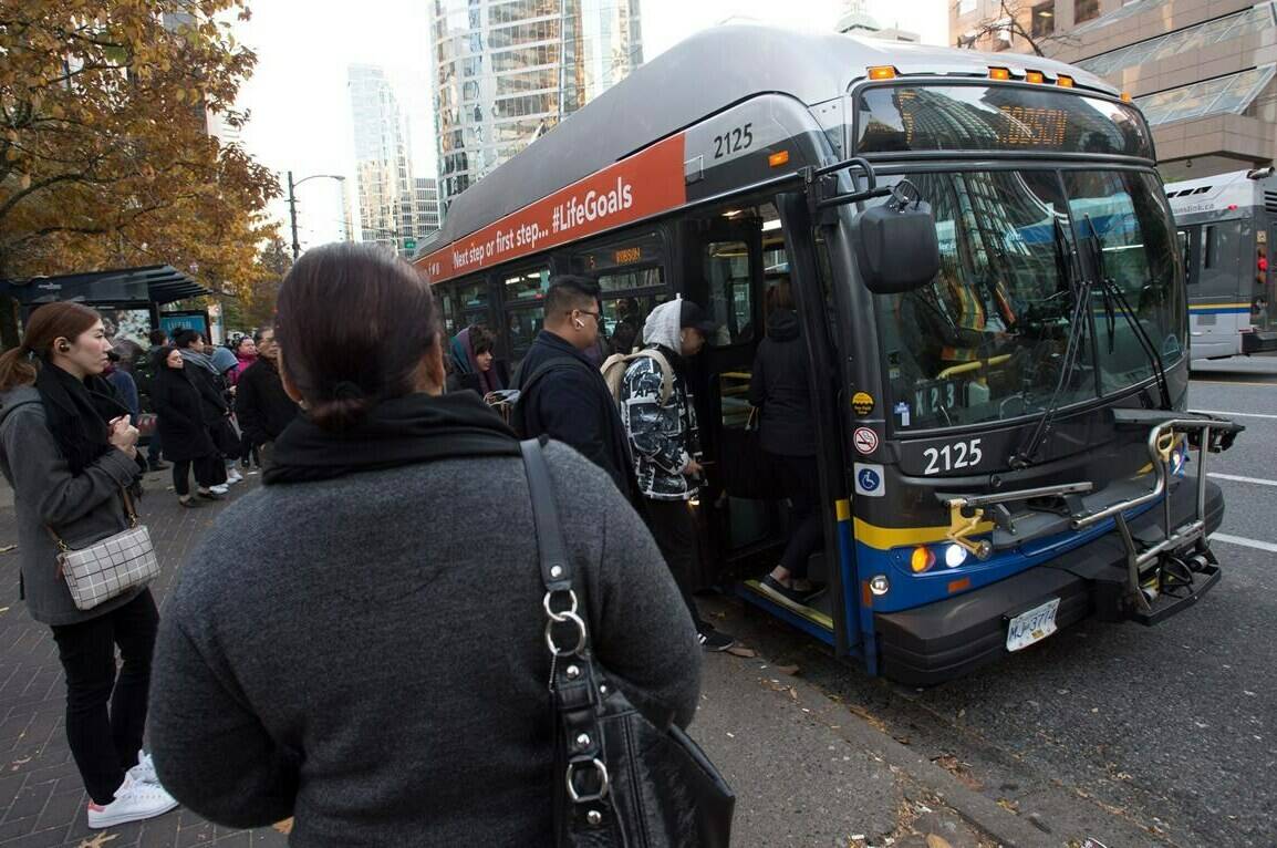 A union representing more than 180 transit workers in B.C. has issued a 72-hour strike notice. Passengers board a bus in downtown Vancouver, B.C., Friday, Nov. 1, 2019. THE CANADIAN PRESS/Jonathan Hayward