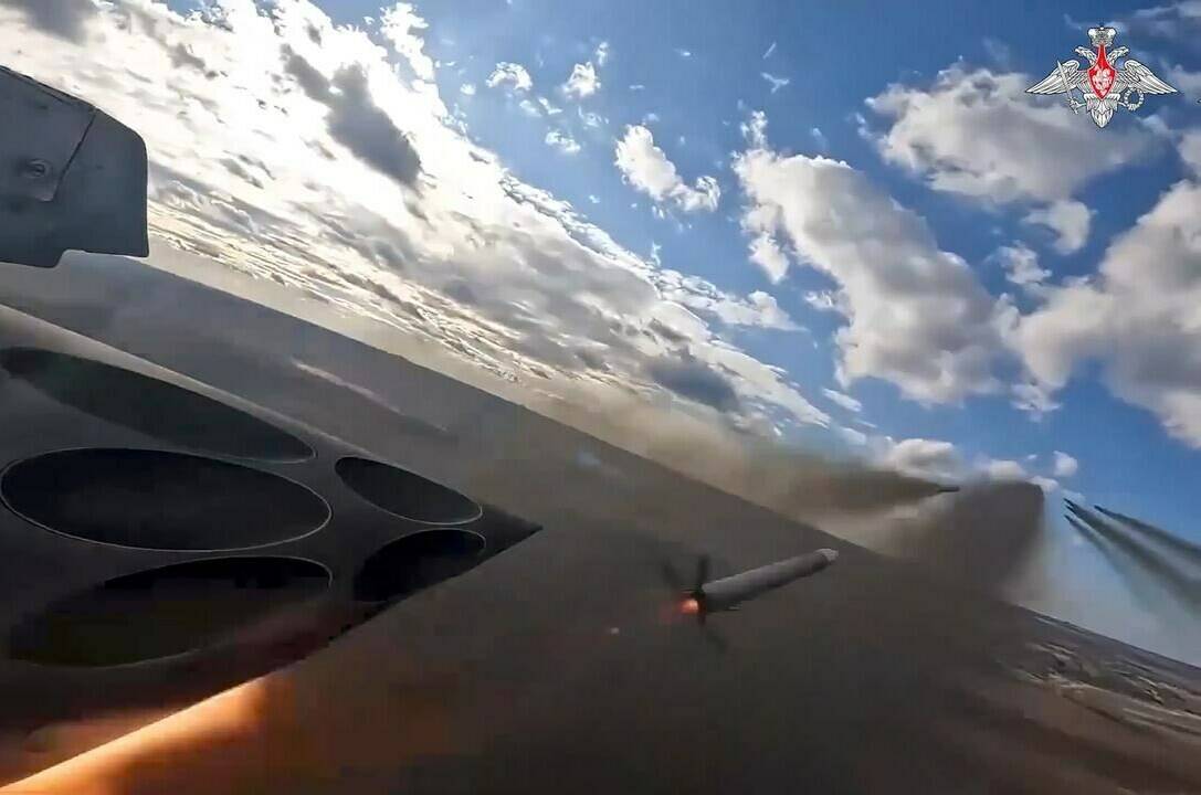 In this photo taken from a video released by the Russian Defense Ministry Press Service on Saturday, Jan. 6, 2024, Su-25 ground attack jets fire rockets during a Russian air force mission in Ukraine. (Russian Defense Ministry Press Service via AP)