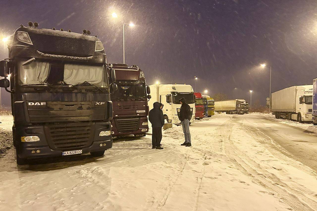 Polish farmers who had blockaded a border crossing to Ukraine ended their protest after reaching an agreement with the government that met their demands, Poland’s state news agency PAP reported Jan. 6, 2023. Ukrainian truck drivers wait to cross from Poland back into Ukraine in Korczowa, Poland, on Thursday Dec. 7, 2023. (AP Photo/Karl Ritter)