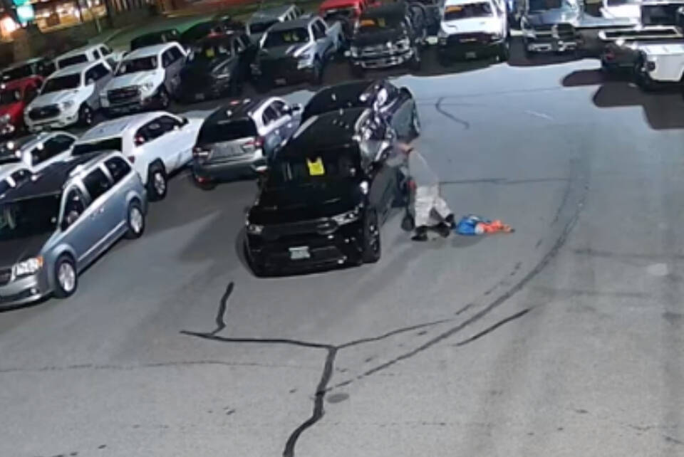 A suspect was caught on video smashing two vehicles with a crow bar at Parkers Chrysler in Penticton on Sunday morning, Jan. 7. (Parkers Chrysler)