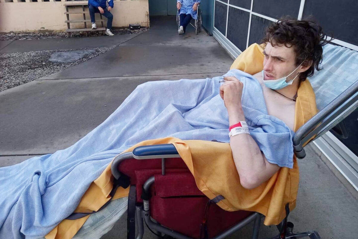 Christopher Petz in hospital while recovering from an incident in which a driver on Highway 97 ran into him while he was on a bicycle. (Photo submitted)