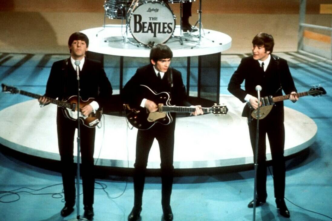 FILE -The Beatles from left, Paul McCartney, George Harrison and John Lennon (with Ringo Starr on drums) perform on the CBS “Ed Sullivan Show” in New York on Feb. 9, 1964. The Television Academy, which presents the Emmy Awards, announced on Friday, Jan. 12, 2024, what it calls the top 75 moments in television history ahead of the ceremony’s 75th edition, being held on Monday, Jan. 15. (AP Photo/File)