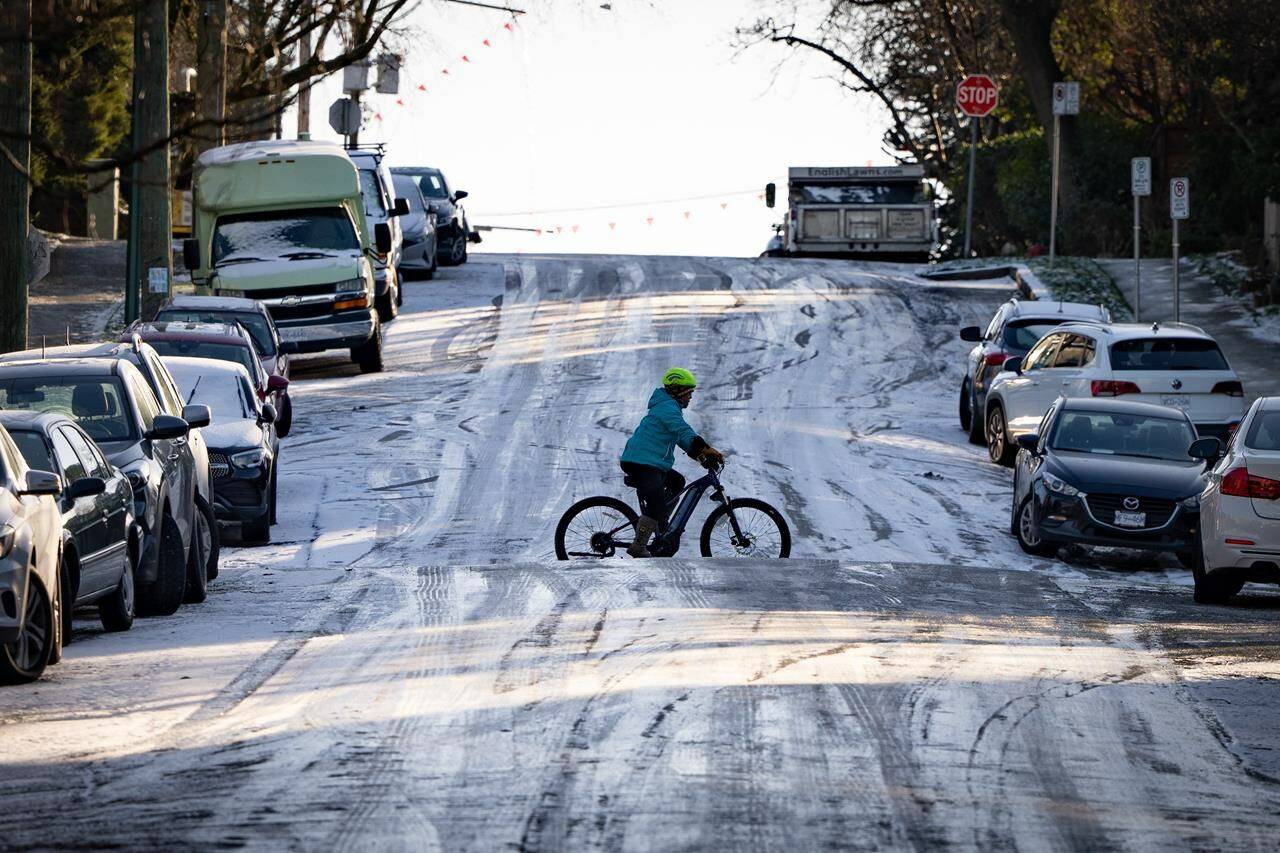 Weather warnings cover much of Canada this weekend, from arctic outflows on British Columbia’s coast to extreme cold through the Prairies and storms through southern Ontario, Quebec and the Maritimes. A cyclist bikes across an icy hill in Vancouver on Friday, Jan. 12, 2024. THE CANADIAN PRESS/Ethan Cairns